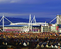 Millennium Stadium urban landscape viewed over rooftops of houses in Cardiff South Wales UK