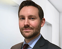 UBS appoints Garnett