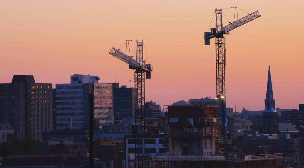 Mandatory Credit: Photo by Design Pics Inc/REX/Shutterstock (5498294a) Construction work cranes towering over the city skyline at dawn Montreal, Quebec, Canada VARIOUS