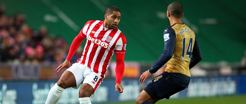 Johnson in action against Arsenal's Theo Walcott